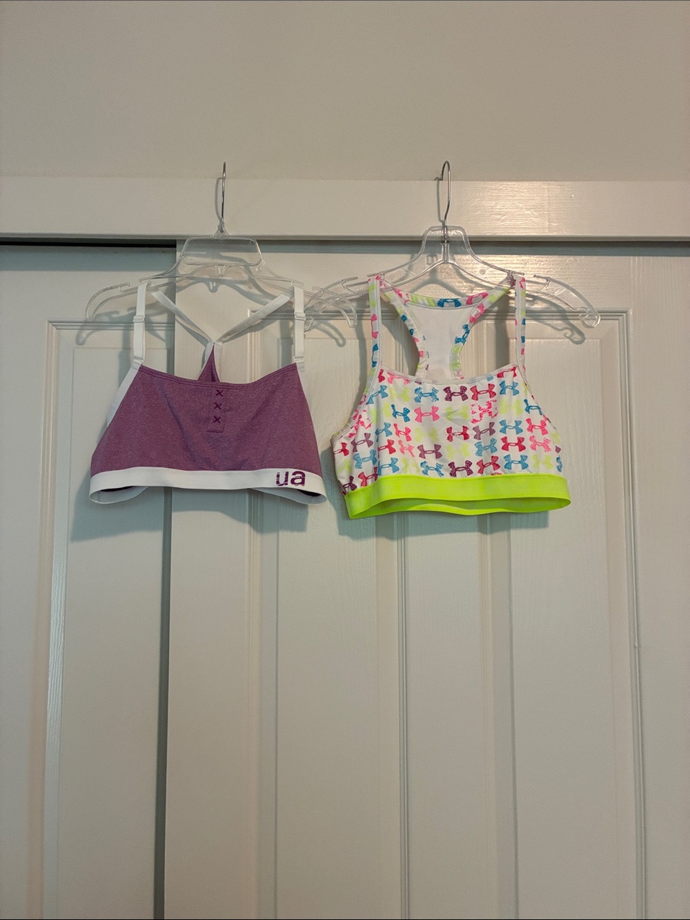 2 Under Armour Sports Bra 1 with Multi-Color Logos and purple with white band